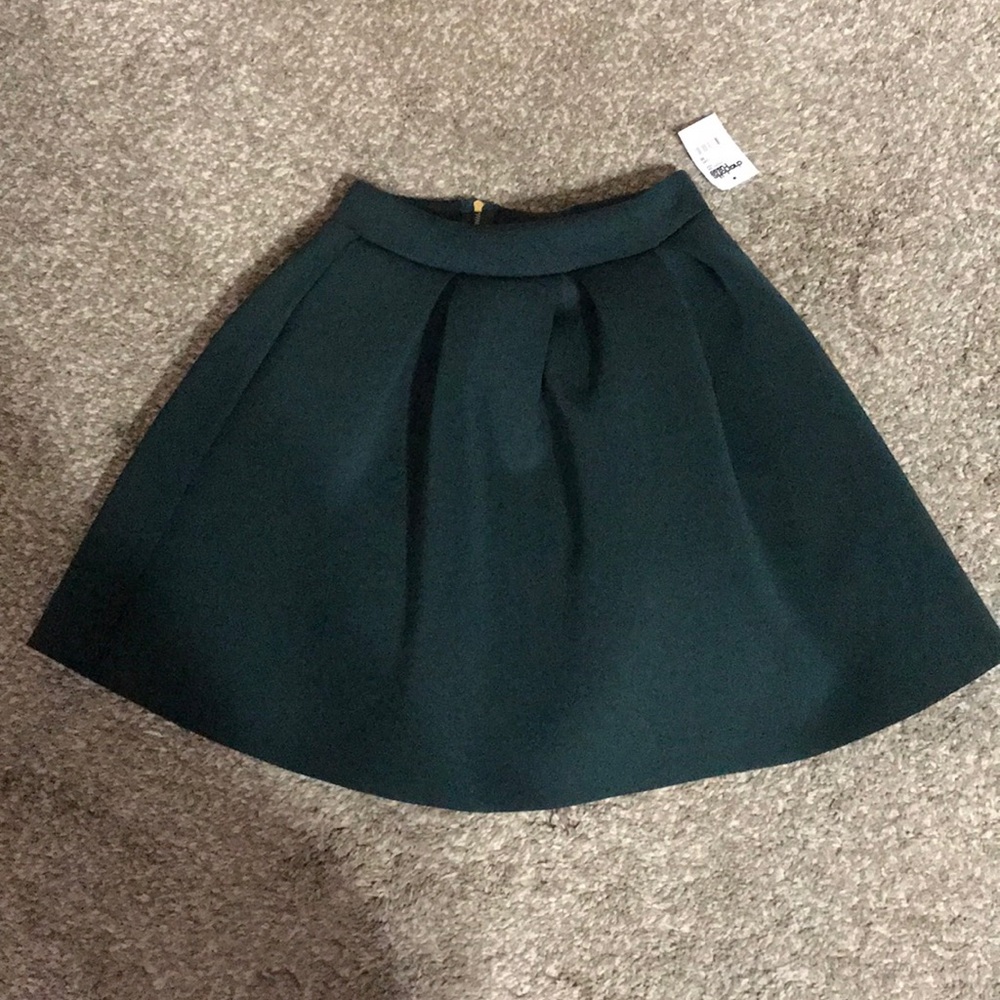 Green pleated skirt